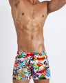 YEAH-YEAH men's beach shorts feature fun and energetic comics-style graphics in bold colors, with a prominent BANG! illustration.