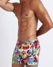 These YEAH-YEAH sexy swims trunks for men feature retro 60s pop energetic comics-style graphics in bold colors with a prominent BANG! sign.