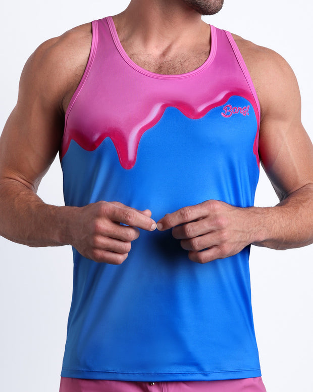 Front view of model wearing the YOU MELT ME men’s beach tank top in a bright blue color featuring pink melting ice cream print by the Bang! Clothes brand of men&