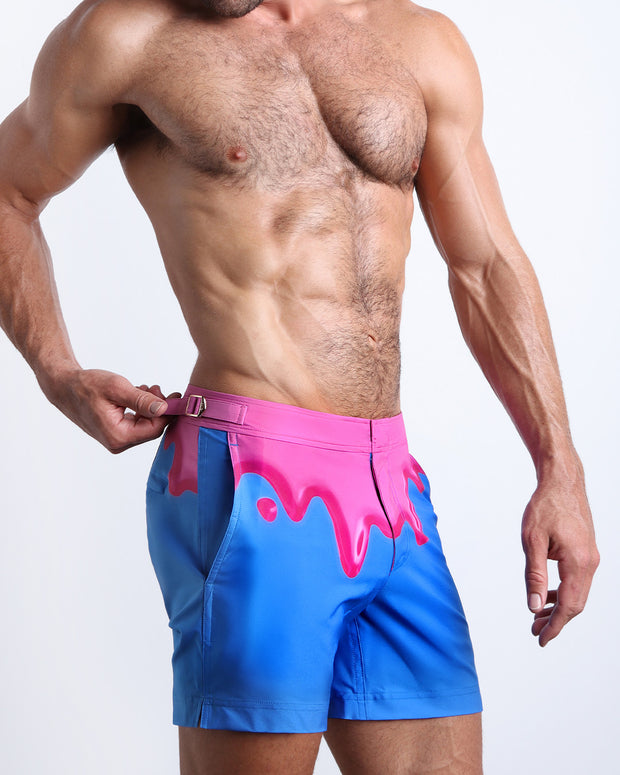 Side view of the men’s YOU MELT ME shorter leg length shorts featuring magenta pink melting ice cream print made by Miami based Bang! brand of men&